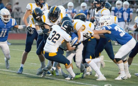 Elisha Meyer/Kitsap News Group Photos
A multitude of Spartans take down the return man on a kickoff vs. the Olympic High Trojans.