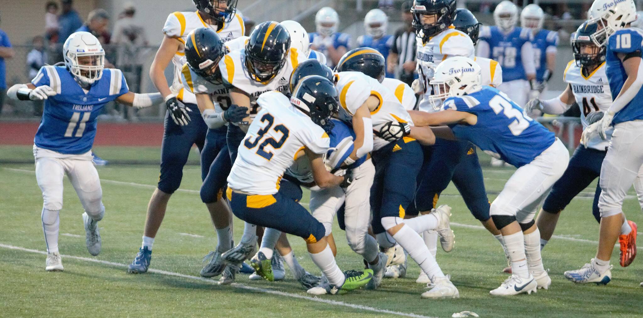 Elisha Meyer/Kitsap News Group Photos
A multitude of Spartans take down the return man on a kickoff vs. the Olympic High Trojans.