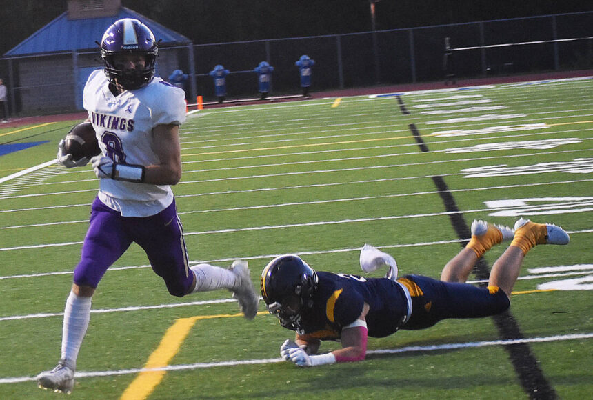 <p>Nicholas Zeller-Singh/Kitsap News Group Photos</p>
<p>Viking Logan Sloman evades defenders and scores a touchdown.</p>