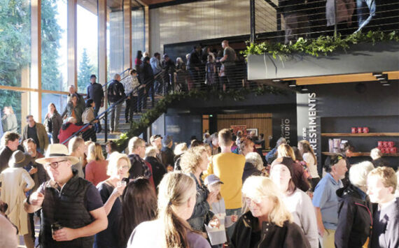 Damon Williams/ Kitsap News Group Photos
As the bright sun shines through the huge new windows at Buxton Center, a crowd gathers to enjoy the grand opening of the remodeled Bainbridge Performing Arts building.