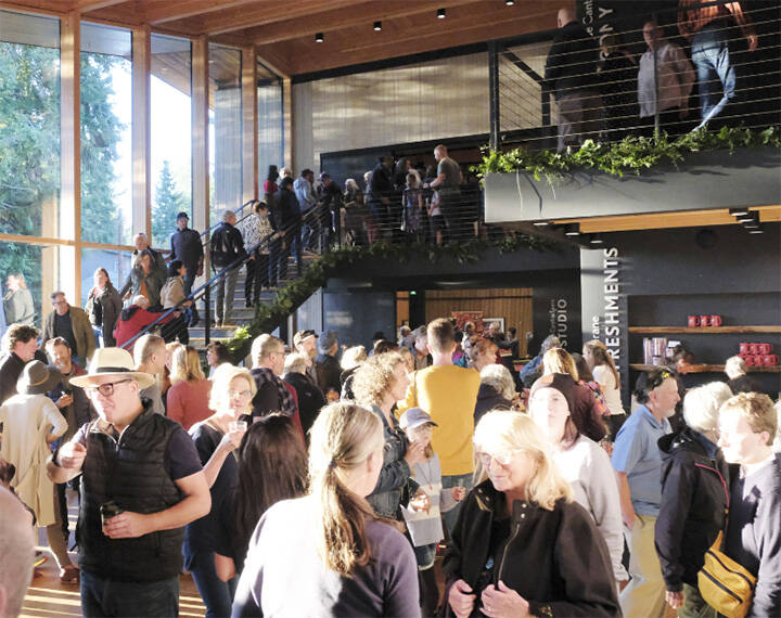 Damon Williams/ Kitsap News Group Photos
As the bright sun shines through the huge new windows at Buxton Center, a crowd gathers to enjoy the grand opening of the remodeled Bainbridge Performing Arts building.