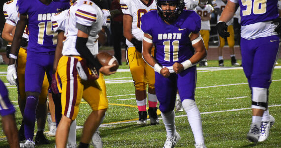 Nicholas Zeller-Singh/Kitsap News Group Photos
Viking Ben Gomez flexes his muscles after a big tackle.