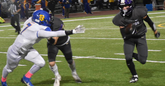 Nicholas Zeller-Singh/Kitsap News Group Photos
Viking Cohen Meis runs down the sideline for a first down.