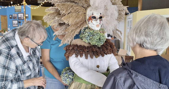 Elisha Meyer/Kitsap News Group
A group of women prepare a display in the Port Orchard Scarecrow Contest.