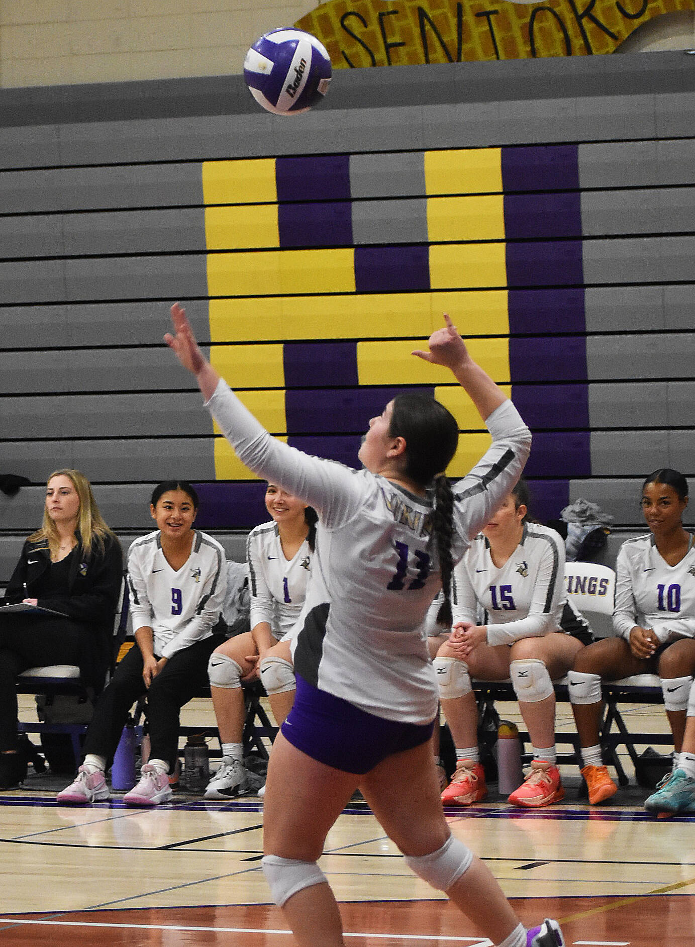 Fendi Dowlearn of NK serves the ball to Sequim.