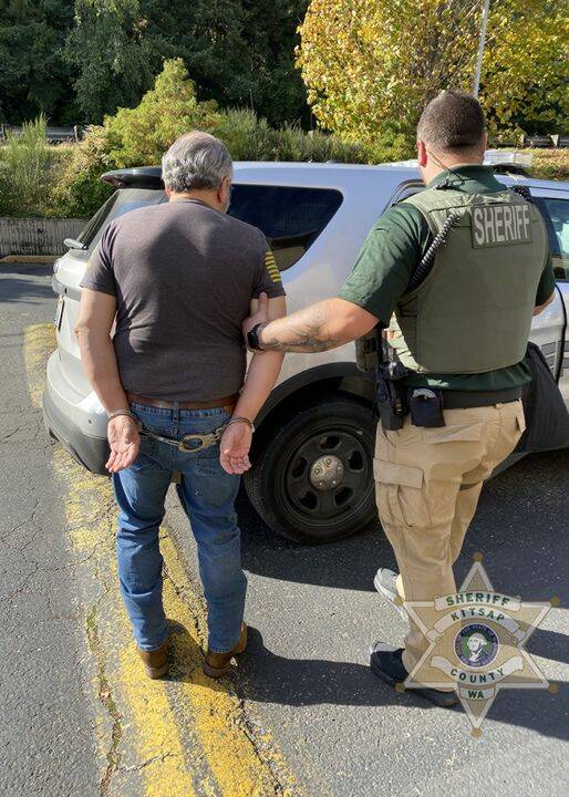 KCSO courtesy photo
The Bremerton suspect in a possible child trafficking case is led to a KCSO vehicle after being placed in handcuffs.