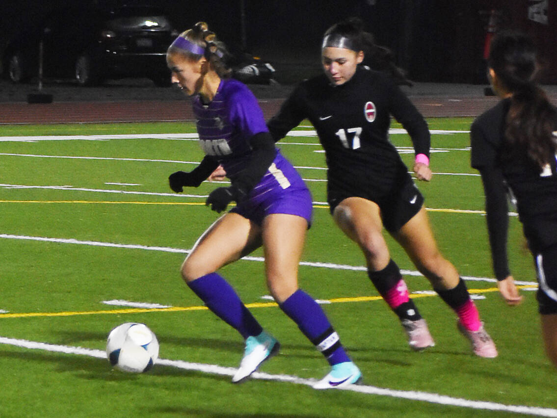 Andrea Zetty clears the ball up to North Kitsap’s strikers.