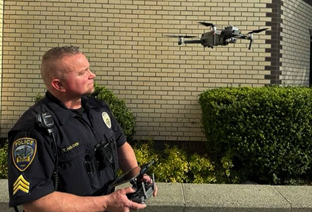 Mike De Felice/Kitsap News Group Photos
Sgt. Trey Holden launches one of the crime-fighting drones, which can go places officers can’t because of the danger involved.