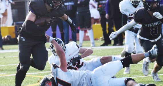 Nicholas Zeller-Singh/Kitsap News Group Photos
Lelond Anderson of NK jukes a pair of defenders for the first down.