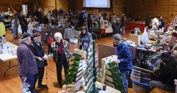 Damon Williams/Kitsap News Group photos
Attendees seeking holiday gifts check out items at a recent craft fair in Suquamish.