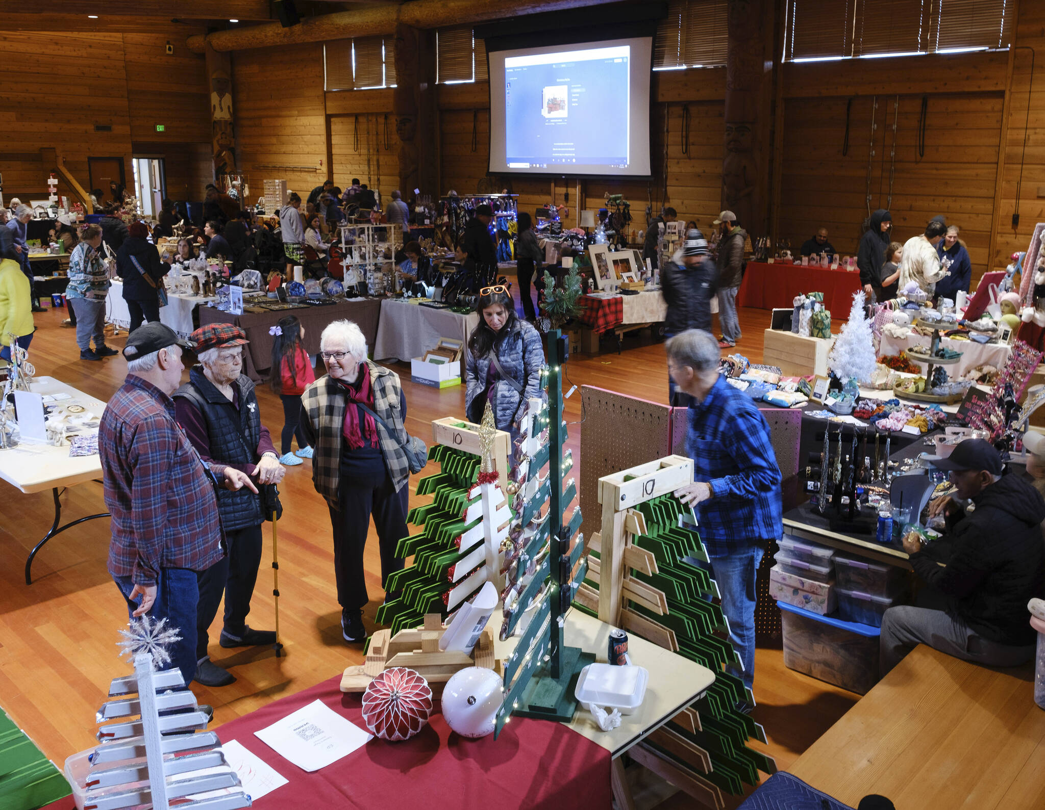 Damon Williams/Kitsap News Group photos
Attendees seeking holiday gifts check out items at a recent craft fair in Suquamish.