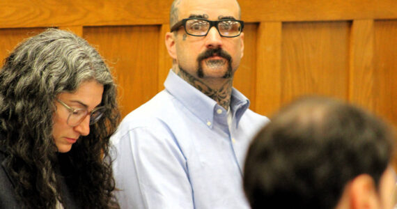 Elisha Meyer/Kitsap News Group Photos
Danie Jay Kelly Jr. stares at the camera while sitting by his attorneys.