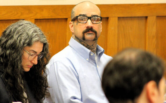 Elisha Meyer/Kitsap News Group Photos
Danie Jay Kelly Jr. stares at the camera while sitting by his attorneys.
