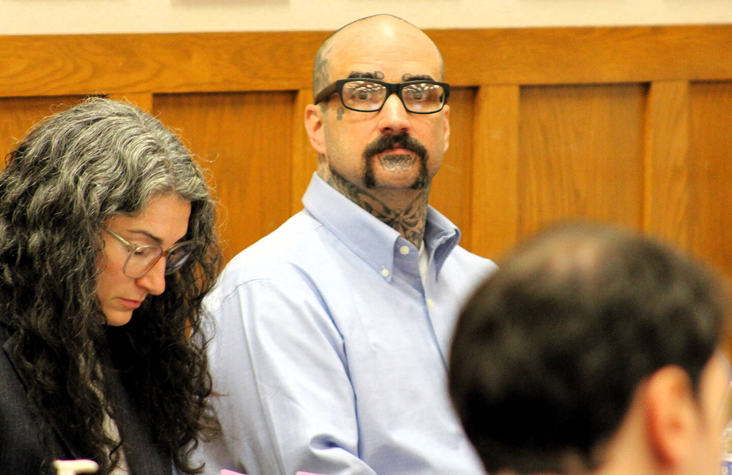 Elisha Meyer/Kitsap News Group Photos
Danie Jay Kelly Jr. stares at the camera while sitting by his attorneys.