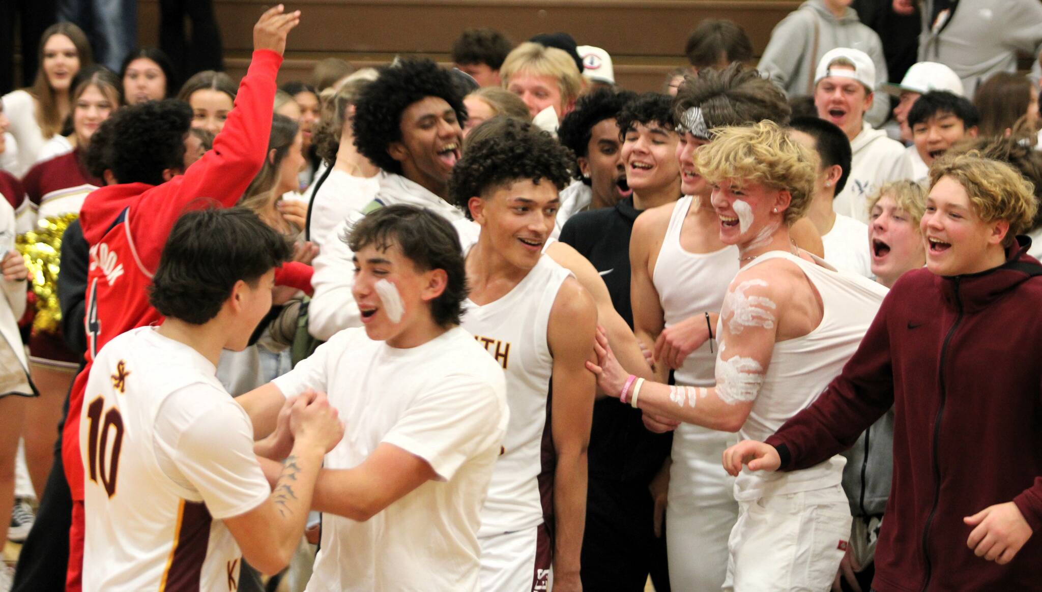 Elisha Meyer/Kitsap News Group Photos
Senior Kenny Miller smiles as the South Kitsap students celebrate on the court.