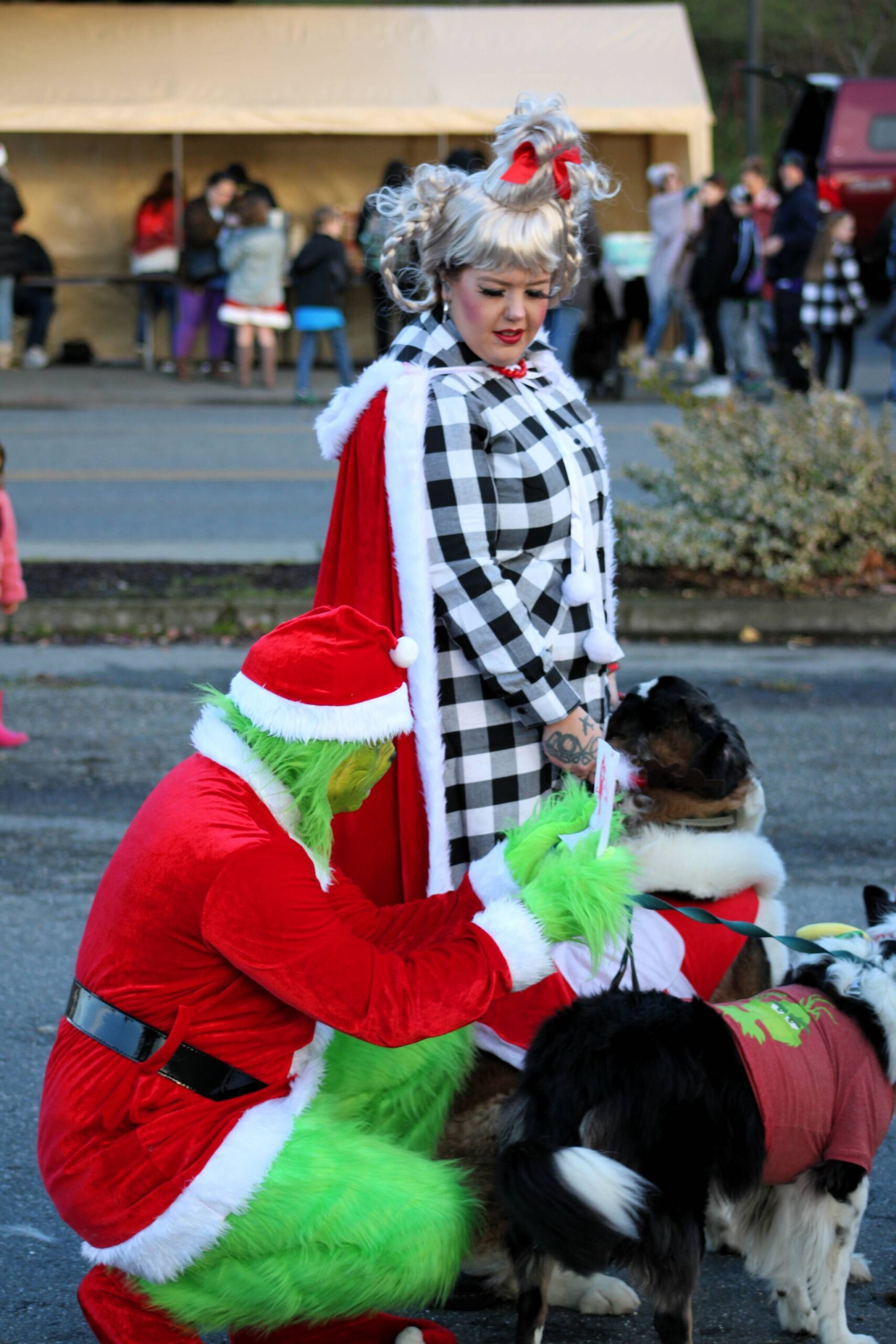 Chase Austin (lower left) and Stephanie Gay (center) show they’ve got plenty of holiday style in their parade-winning costumes.
