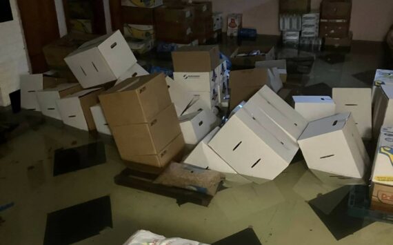 South Kitsap Helpline courtesy photo
Standing water in the basement of the South Kitsap Helpline property consumes and topples several boxes containing dry food storage.