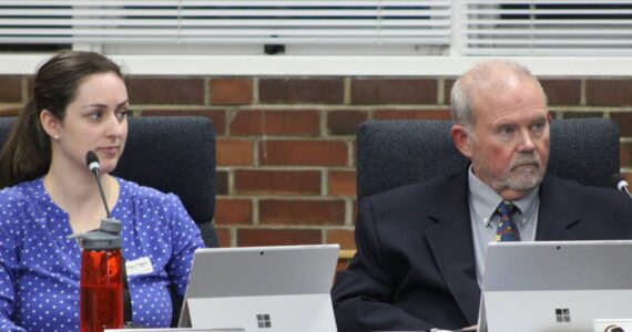 SKSD courtesy photo
Megan Higgins (left) and Jay Villars (right) sit next to one another minutes after being sworn into the South Kitsap School District Board of Directors.