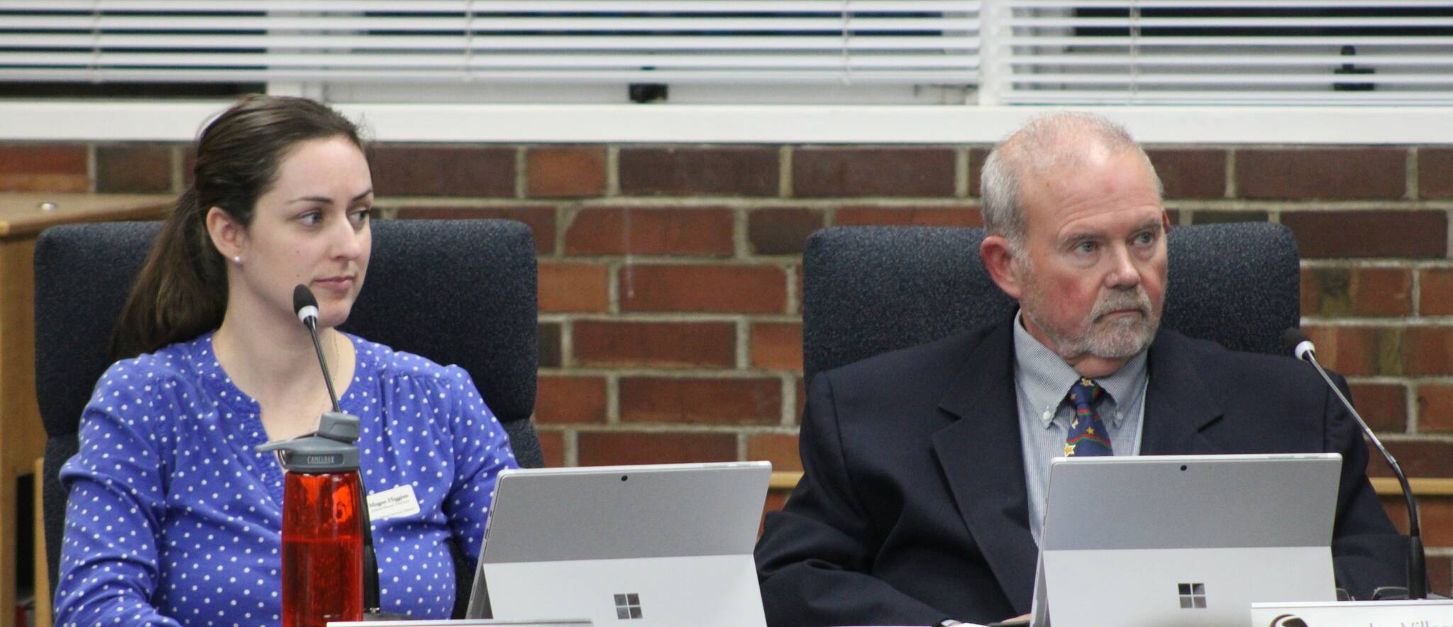 SKSD courtesy photo
Megan Higgins (left) and Jay Villars (right) sit next to one another minutes after being sworn into the South Kitsap School District Board of Directors.