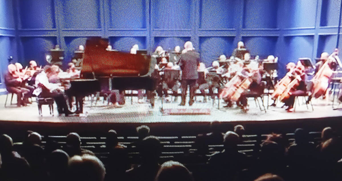 The symphony on stage, featuring Alec Rodriguez, left.