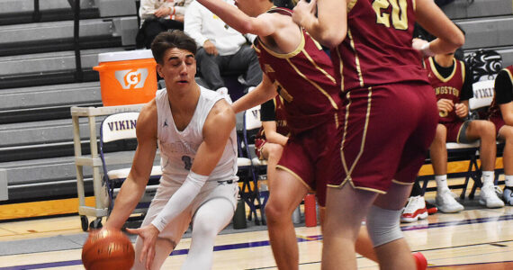Nicholas Zeller-Singh/Kitsap News Group Photos
NK guard Cade Orness, who led the team with 31 points, drives inside against the Buc bigs.