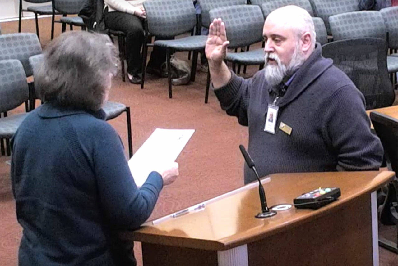 Rick Eckert is sworn into council by Mayor Becky Erickson.