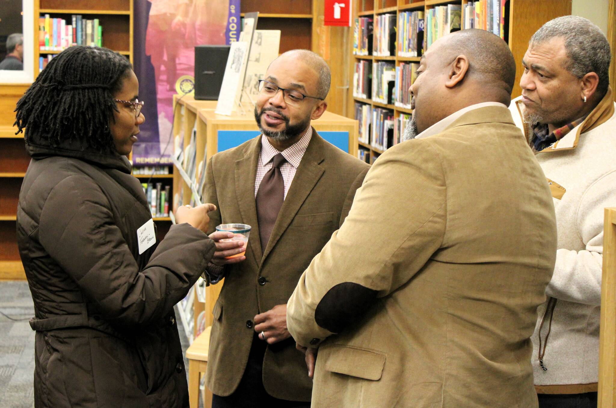 Elisha Meyer/Kitsap News Group Photos
KRL executive director Jason Driver (second from left) speaks with guests at the ceremony for the newly renamed Martin Luther King Jr. branch.
