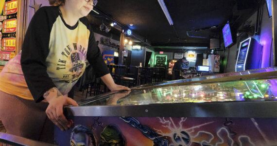 Damon Williams/Kitsap News Group Photos
Jessica Barron plays a pinball machine at a recent tournament in Bremerton.