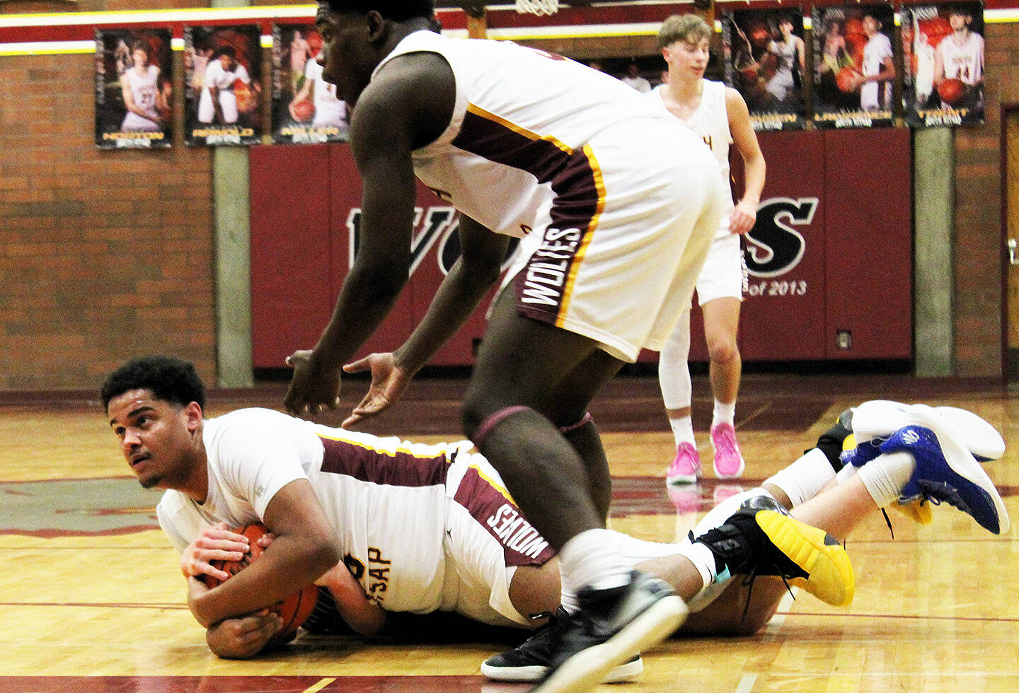 Elisha Meyer/Kitsap News Group
A scramble for the ball takes players to the floor at South Kitsap High School.