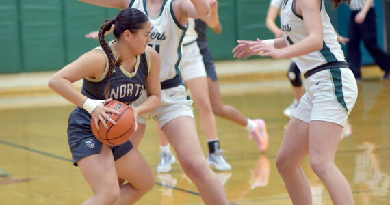Keith Thorpe courtesy photos
North Kitsap’s Tiffany Le, left, tries to evade the defense of Port Angeles’ Lexie Smith, center, and Lindsay Smith, right, on Tuesday at Port Angeles High School.