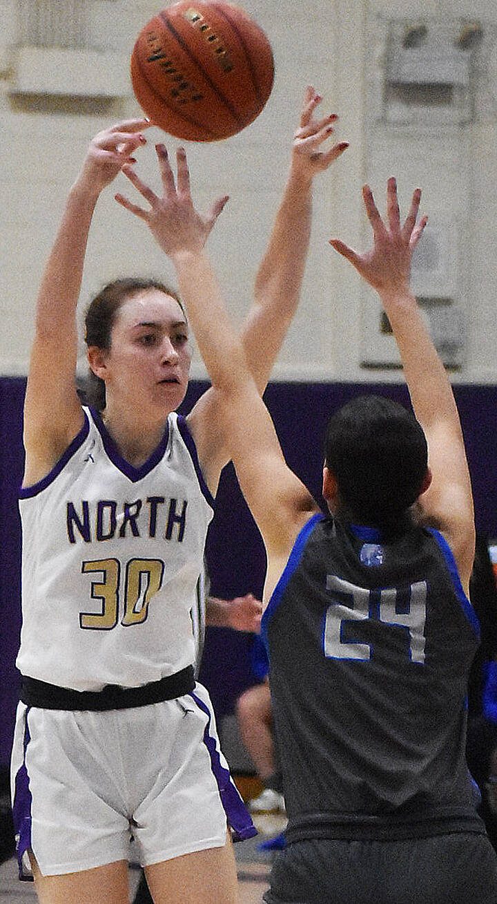 Nicholas Zeller-Singh/Kitsap News Group Photos
Vikinng Avery Kline reaches over Trojan Sophia Brown for the ball.