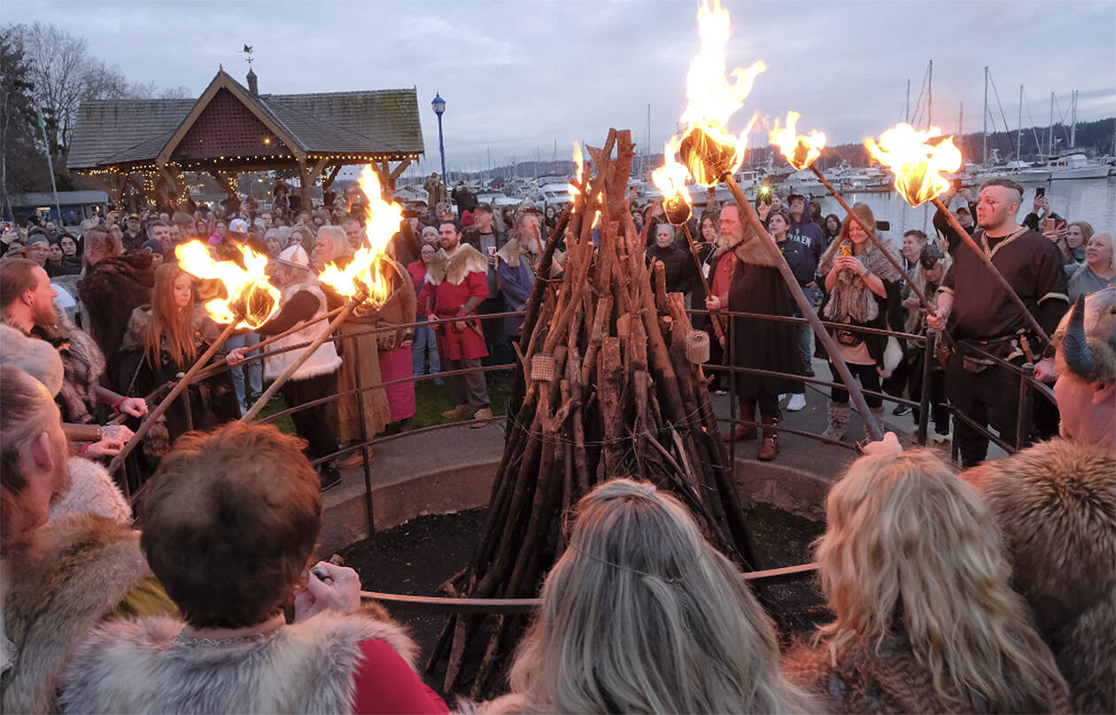 Damon Williams/Kitsap News Group Photos
Vikings from the Sons of Norway get set to light the bonfire on the Poulsbo Waterfront Feb. 10.