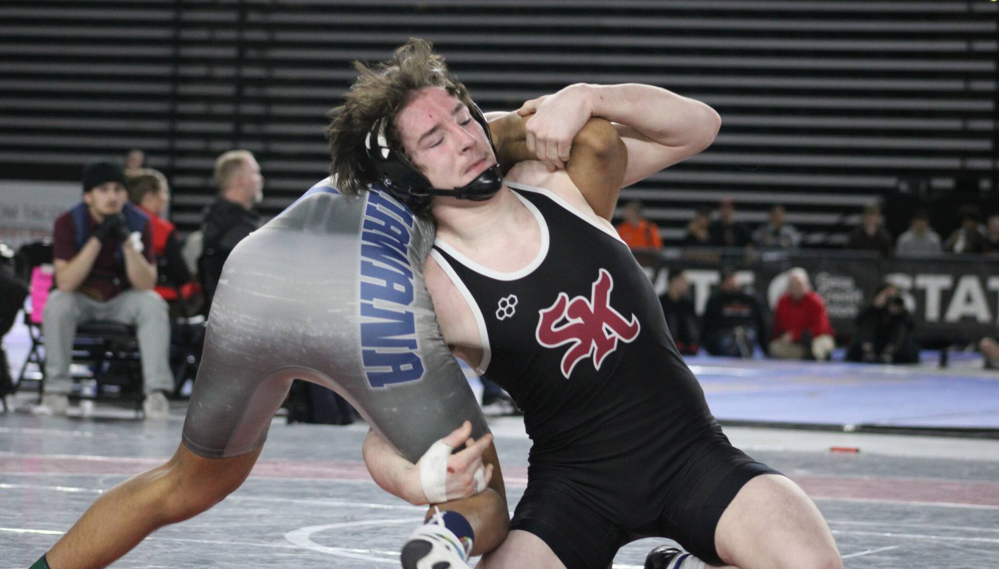 Elisha Meyer/Kitsap News Group Photos
Senior Stone Hartford keeps hold of his opponent en route to winning the state championship bout.