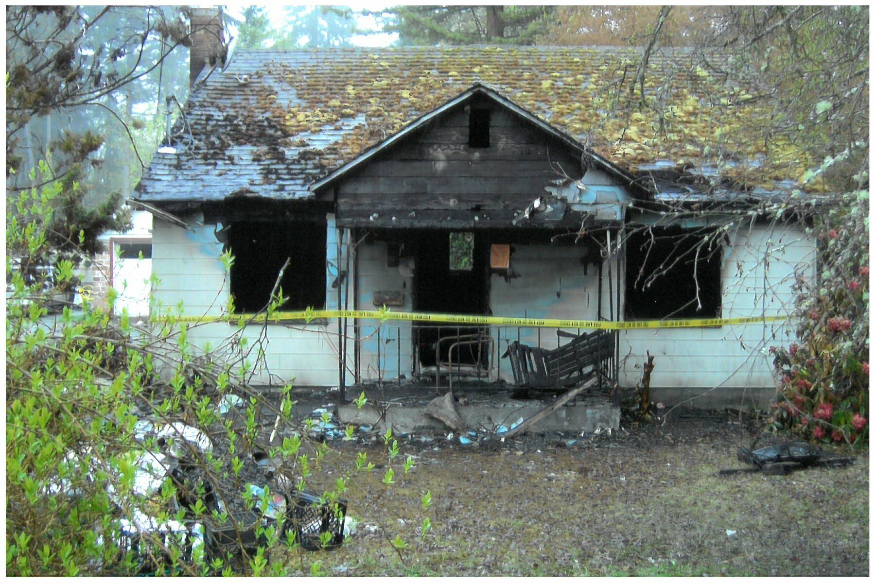 Linda Malcom family courtesy photo
The burned house where Linda Malcom was found murdered.