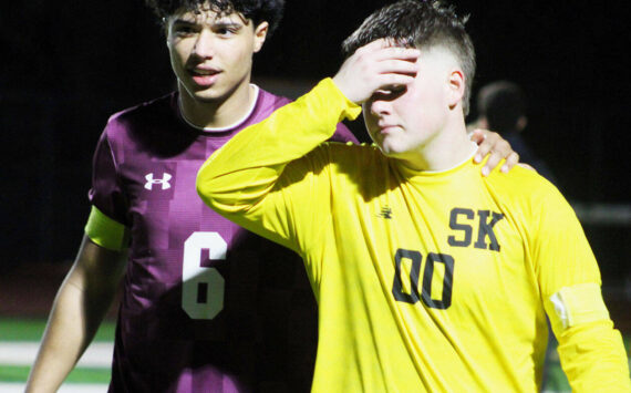 Elisha Meyer/Kitsap News Group photos
Senior Brandon Durr, left, walks off the field with his hand around the shoulder of senior goalie Landon Kirby seconds after Olympia’s victory over the South Kitsap Wolves.