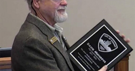 City of Poulsbo courtesy photos
Outgoing councilmember David Musgrove receives a plaque from the city at his last meeting March 20.