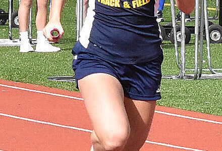 File photo
Bainbridge’s Laine Romney finishes second in the 100-meter event.