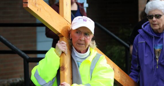 Elisha Meyer/Kitsap News Group photos
Tina Holmes shoulders the weight of the cross for the first leg of the 30th annual Cross Walk.