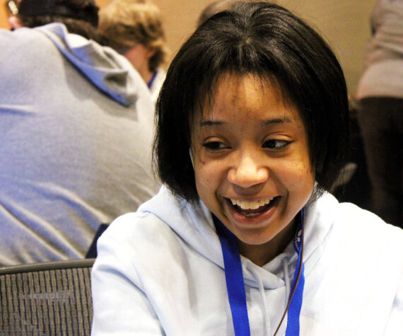 Elisha Meyer/Kitsap News Group photos
Mihelia Thomas, 16, shares a smile with her sister during a tabletop game.