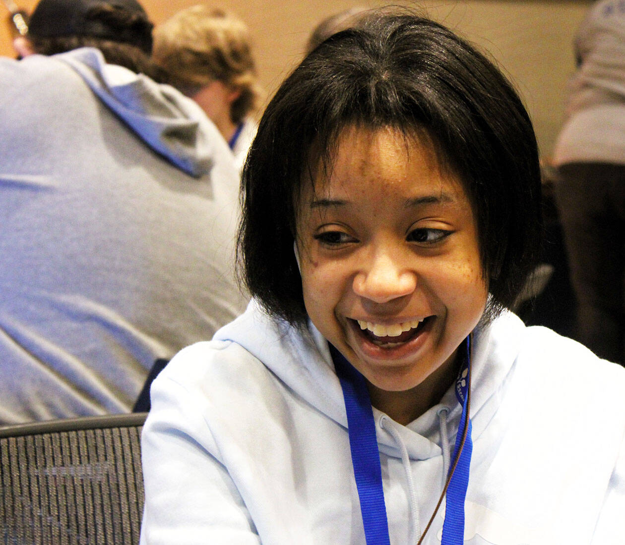 Elisha Meyer/Kitsap News Group photos
Mihelia Thomas, 16, shares a smile with her sister during a tabletop game.