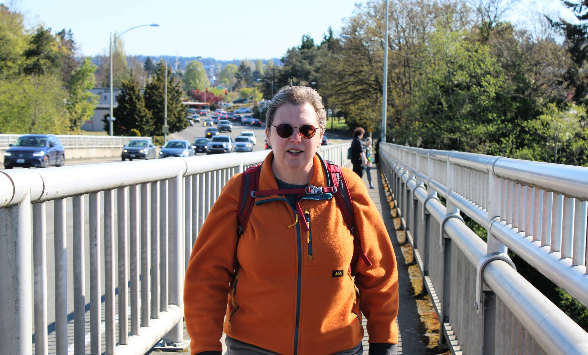 Elisha Meyer/Kitsap News Group
Kandace MacKaben takes to her walk up the narrow Warren Avenue walkway on the west side of the bridge.