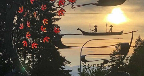 City of Poulsbo courtesy photo
The sun sets behind roundabout artwork made by Elijah Burnett.