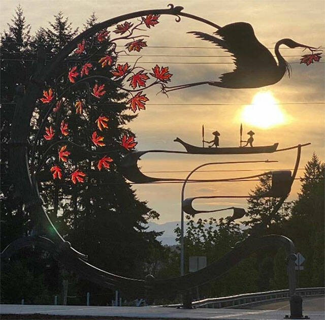 City of Poulsbo courtesy photo
The sun sets behind roundabout artwork made by Elijah Burnett.