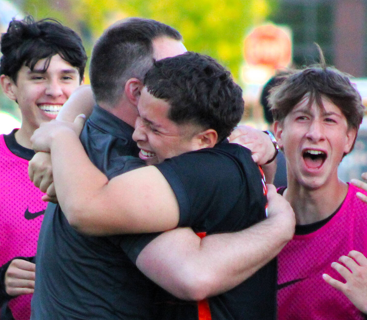 Elisha Meyer/Kitsap News Group photos
Central Kitsap soccer coach Patrick Leonard and junior Joshua Voce embrace, surrounded by cheering teammates after Voce’s game-winning shot.