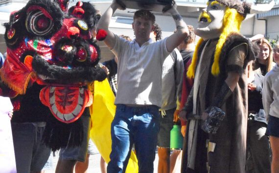 Nicholas Zeller-Singh/Kitsap News Group photos
Noah Sorenson and the mascots celebrate a parade around the school.