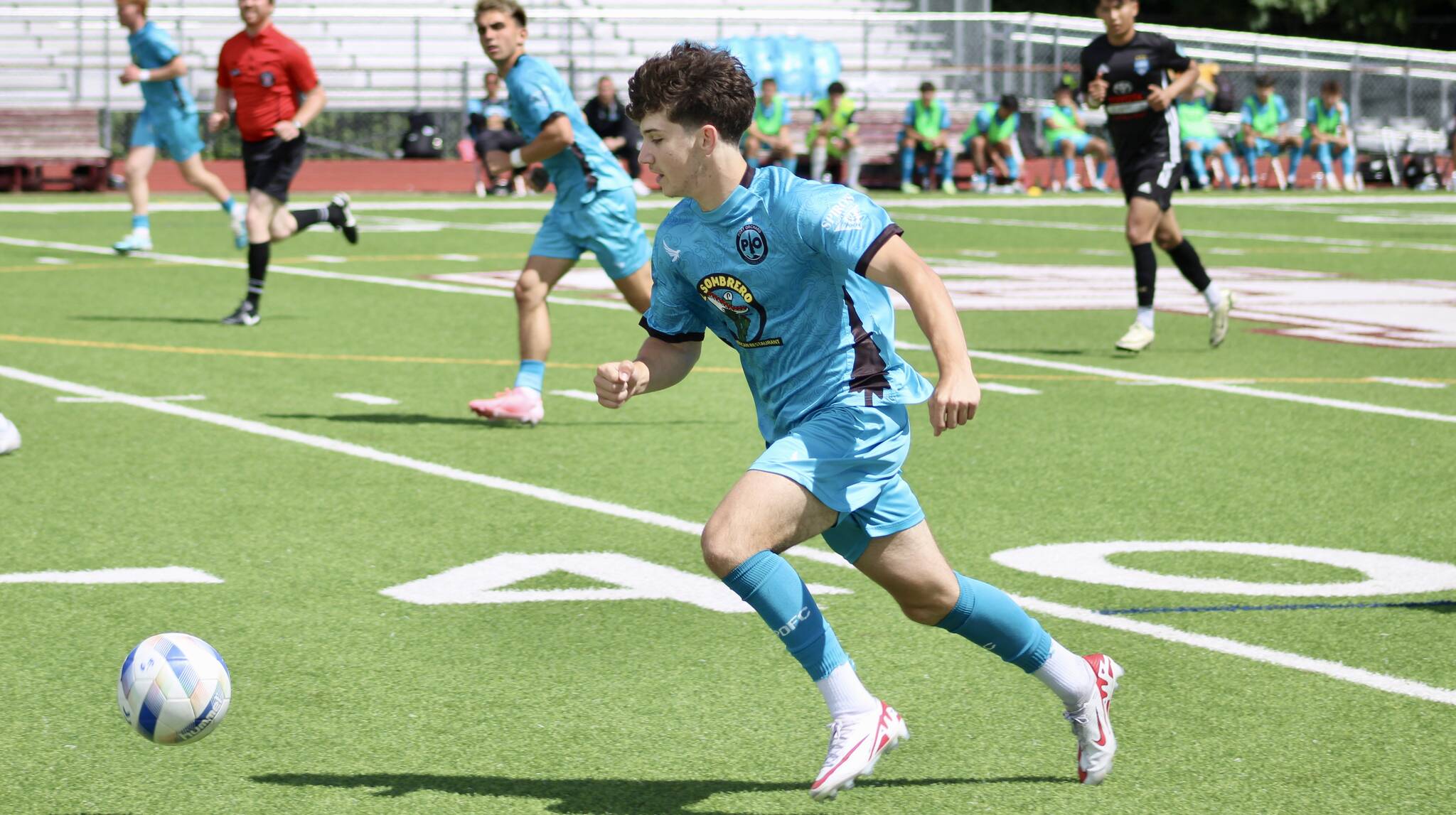 Elisha Meyer/Kitsap News Group photos
POFC’s Derek Johnson dribbles the ball downfield.