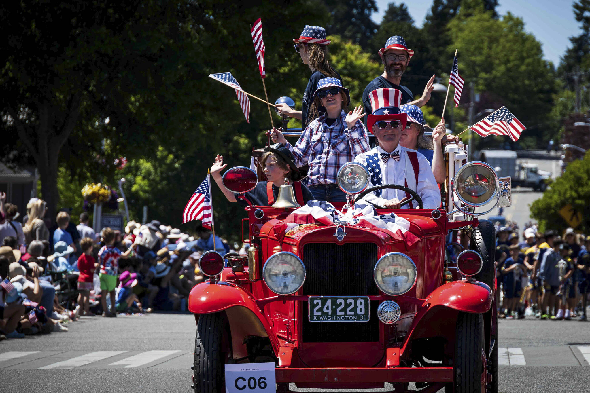 Jonathan Palmer courtesy photos
Uncle Sam drives an antique vehicle packed with folks in July 4 regalia in front of the many visitors who attended the Grand Old 4th of July in Bainbridge Island Thursday.