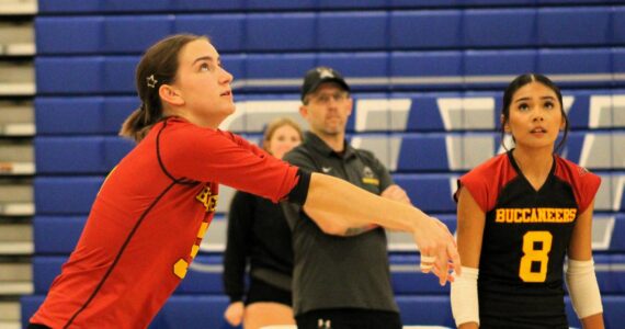 Elisha Meyer/Kitsap News Group photos
Buc senior Corynn Heuer, left, gets the serve up in a match at Olympic High School.