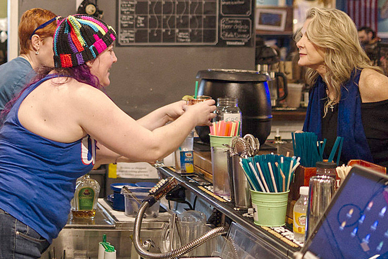 Joseph Forsthoffer courtesy photos
Bartenders serve customers Jan. 17 at Slippery Pig Brewery in downtown Poulsbo.