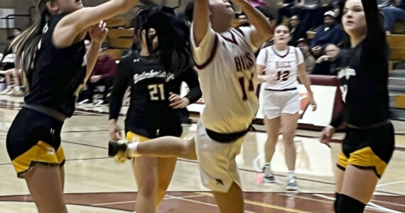 Luke Caputo/Kitsap News Group photos
Kingston junior Tati Fontes-Lawrence goes in for a contested layup in a 69-36 loss to Bainbridge Jan. 31 at Kingston High School.